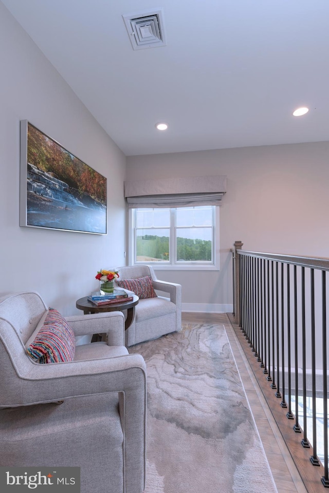 sitting room with recessed lighting, visible vents, baseboards, and wood finished floors