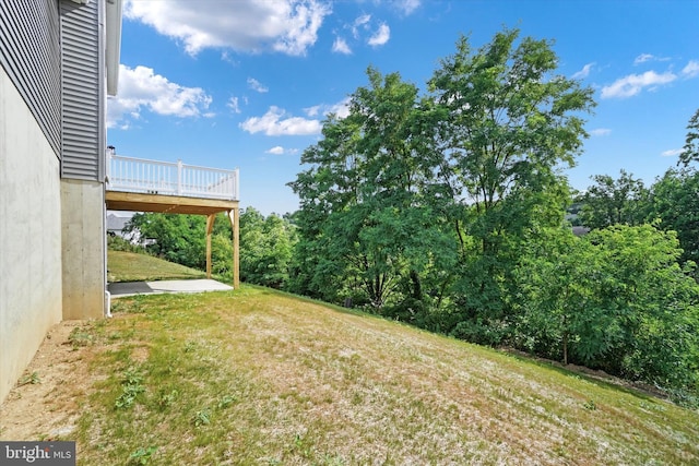 view of yard with a wooden deck