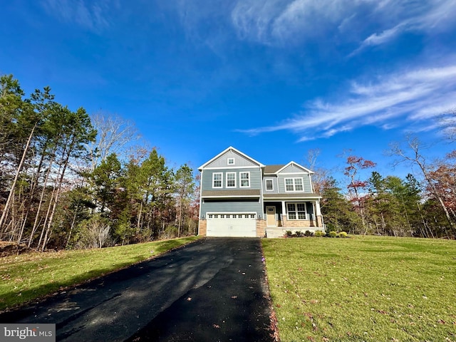 view of front of house with a porch, a garage, and a front yard