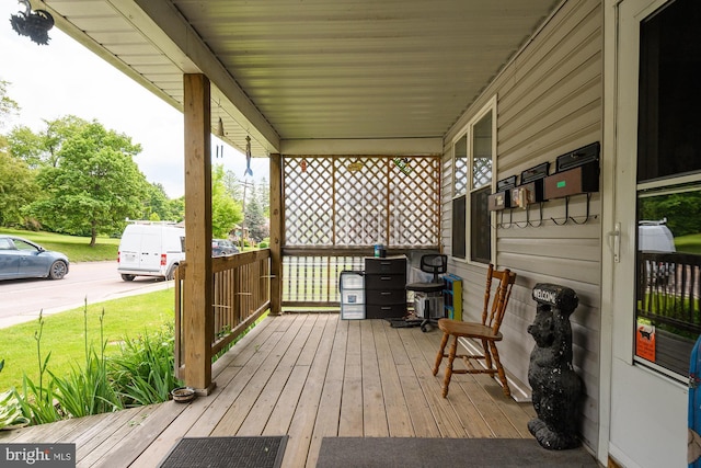 wooden deck featuring covered porch