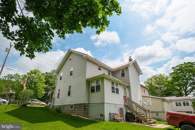 back of house with a yard