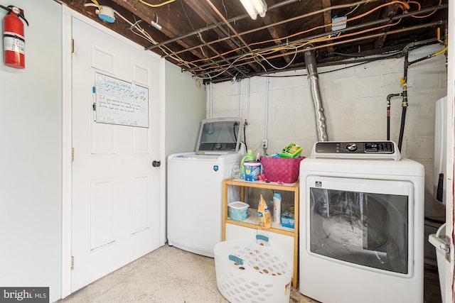 washroom with washing machine and dryer