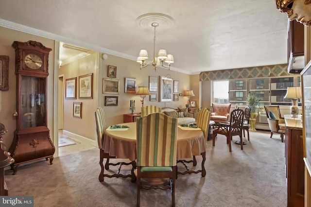 dining space featuring a notable chandelier, ornamental molding, and carpet floors