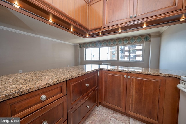 kitchen featuring light stone countertops and ornamental molding