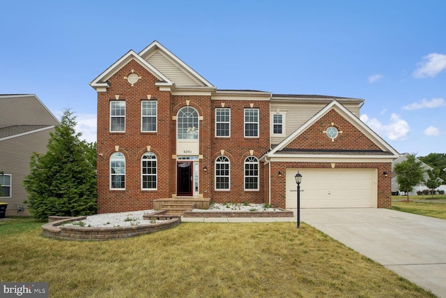 view of front of house featuring a garage and a front yard