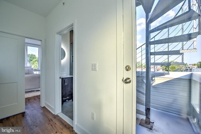 doorway featuring dark hardwood / wood-style floors