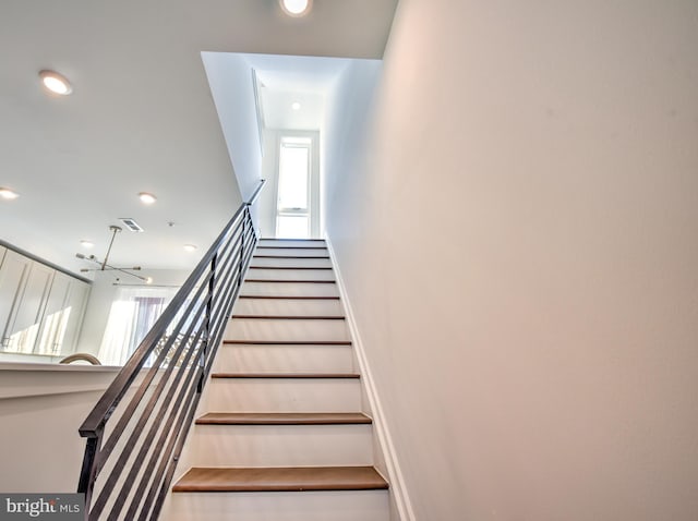 staircase featuring hardwood / wood-style floors