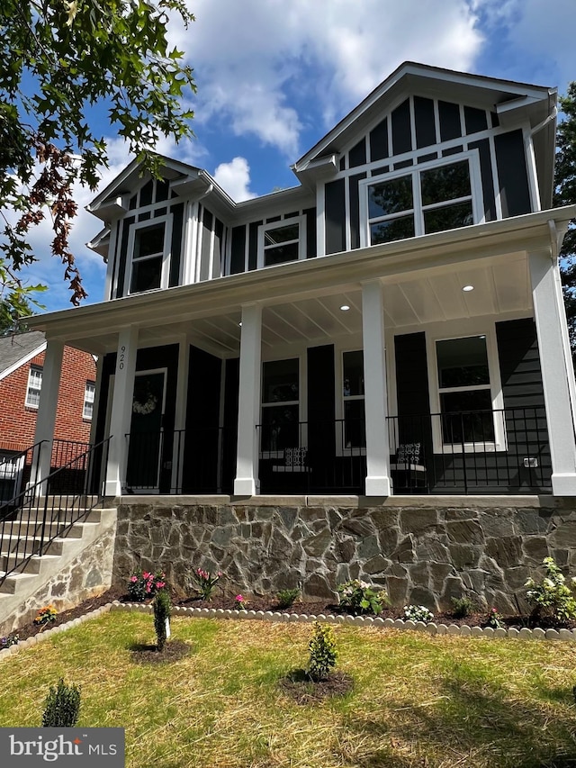 920 Brompton St, Fredericksburg, VA 22401 - view of front facade with a porch, a front lawn, and stone siding