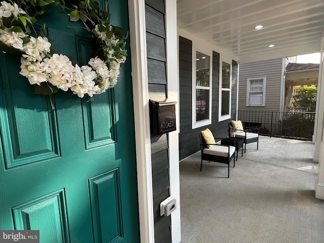 doorway to property featuring covered porch