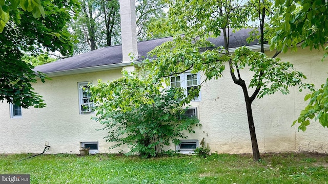 view of home's exterior featuring a lawn