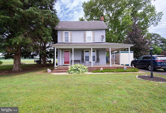 farmhouse-style home featuring a porch and a front lawn