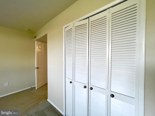 hallway featuring carpet floors