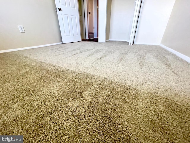 unfurnished bedroom with carpet and a closet