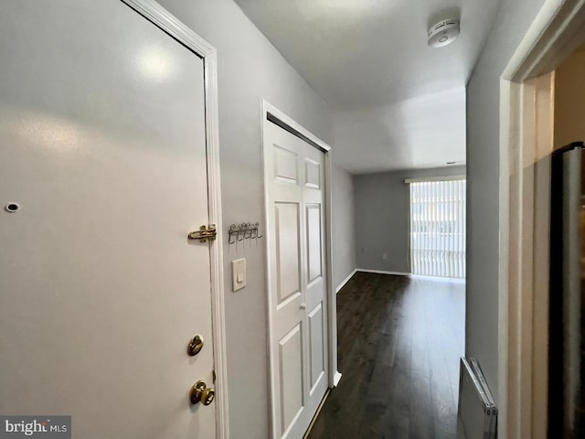 hallway featuring dark hardwood / wood-style floors