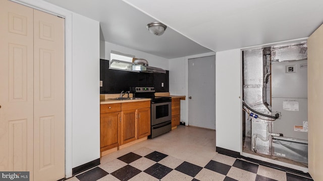 kitchen featuring electric range and sink