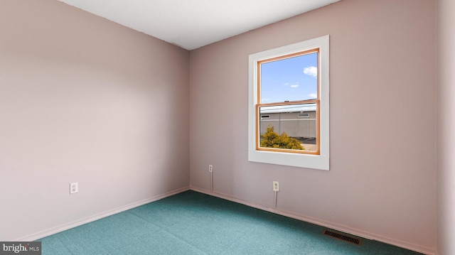 unfurnished room featuring carpet flooring