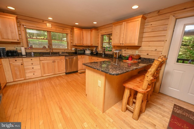 kitchen featuring dishwasher, a wealth of natural light, and light hardwood / wood-style flooring