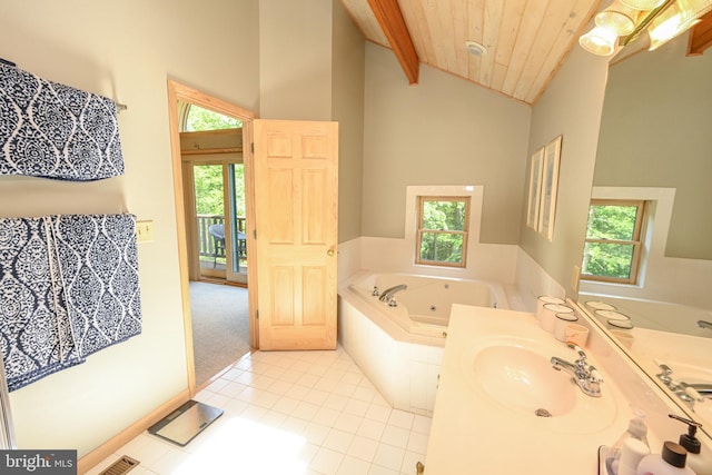 bathroom with beam ceiling, wooden ceiling, and a healthy amount of sunlight