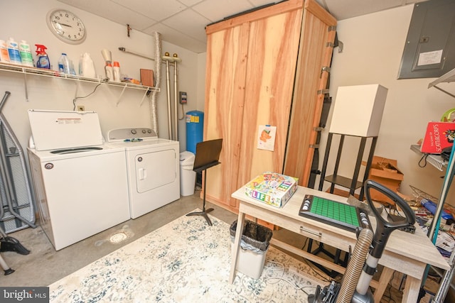 laundry area with washing machine and dryer and electric panel