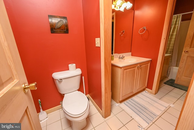 bathroom featuring tile patterned flooring, vanity, a shower with shower curtain, and toilet