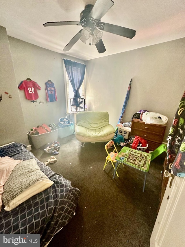 bedroom featuring ceiling fan and carpet floors