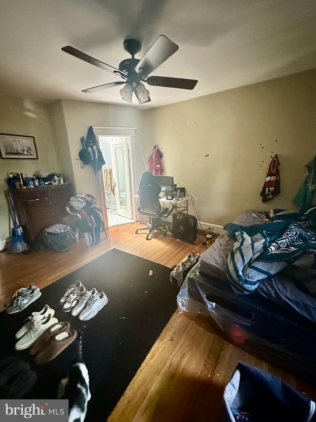 bedroom featuring ceiling fan and wood-type flooring