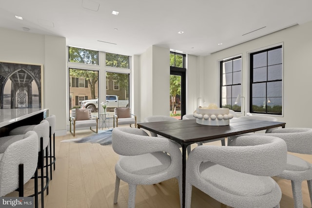 3255 Prospect St NW One, Unit One, Washington, DC 20007 - dining area featuring wood finished floors, recessed lighting, and a wall of windows