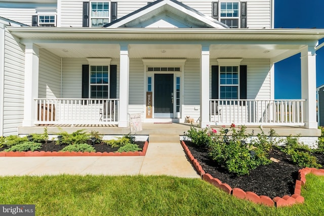 doorway to property featuring a porch