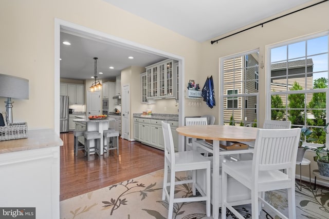 dining room with wood-type flooring