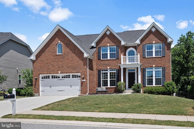 view of front of property featuring a balcony, a garage, and a front lawn