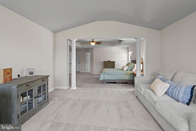 carpeted bedroom featuring ceiling fan, lofted ceiling, and ornate columns