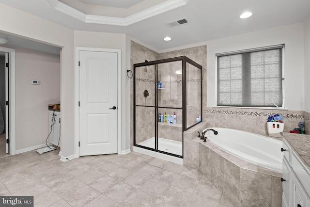 bathroom with a tray ceiling, crown molding, vanity, and shower with separate bathtub