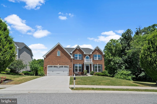 view of front of house with a front yard and a garage