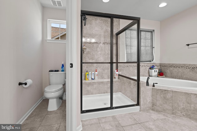 bathroom with tile patterned flooring, independent shower and bath, and toilet