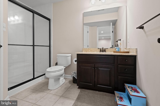 bathroom with tile patterned flooring, vanity, toilet, and walk in shower