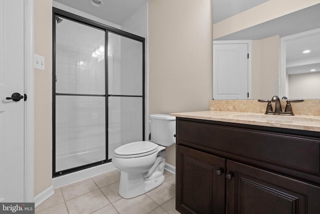 bathroom with toilet, vanity, tile patterned floors, and an enclosed shower