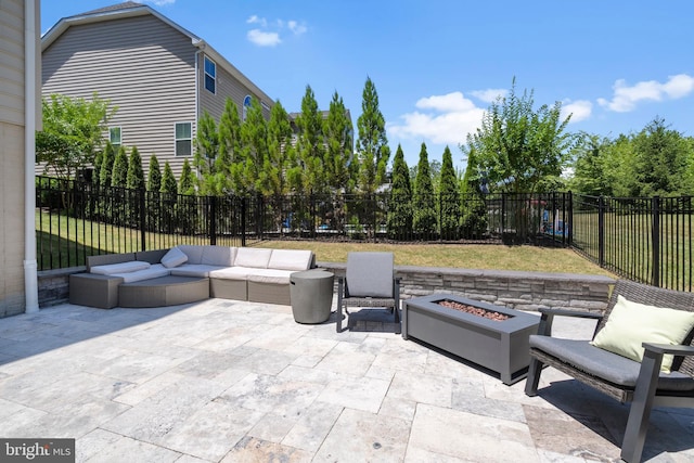 view of patio / terrace featuring an outdoor living space with a fire pit