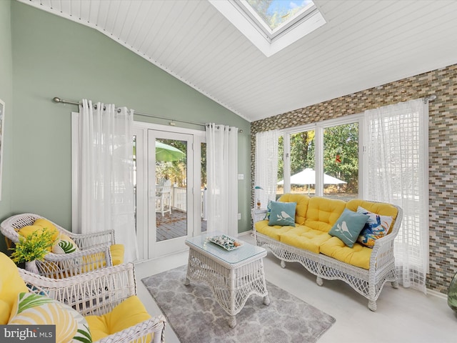 sunroom featuring vaulted ceiling with skylight and wooden ceiling