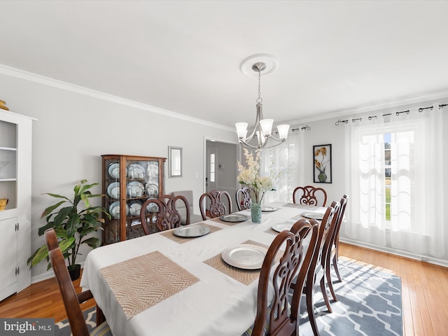 30602 Foxchase Dr, Salisbury, MD 21804 - dining space with crown molding, a chandelier, a wealth of natural light, and light wood-style flooring
