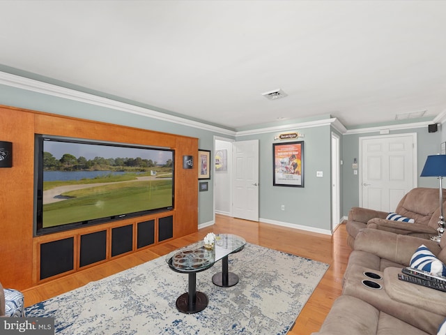 living room featuring crown molding and hardwood / wood-style flooring