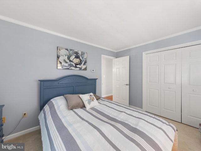 bedroom with ornamental molding, light carpet, and a closet