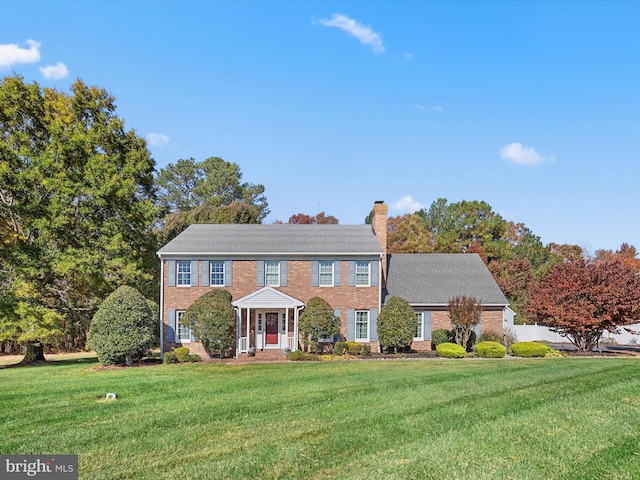 colonial inspired home with a front yard