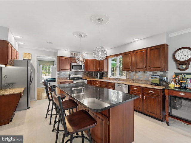 30602 Foxchase Dr, Salisbury, MD 21804 - kitchen featuring crown molding, appliances with stainless steel finishes, decorative backsplash, and a sink