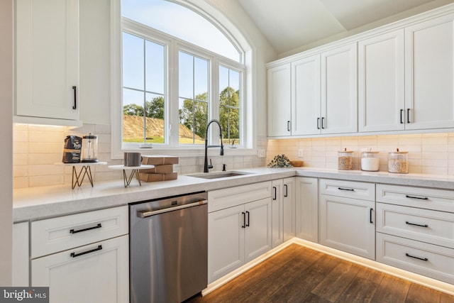 kitchen with dishwasher, dark hardwood / wood-style floors, white cabinetry, and sink