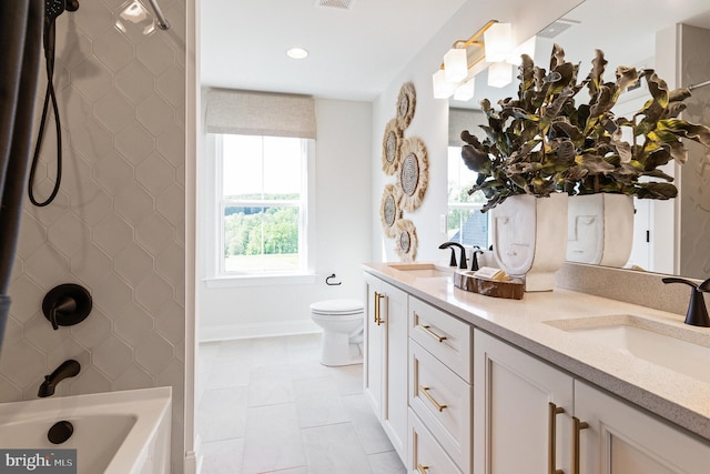 bathroom with tile patterned floors, vanity, and toilet