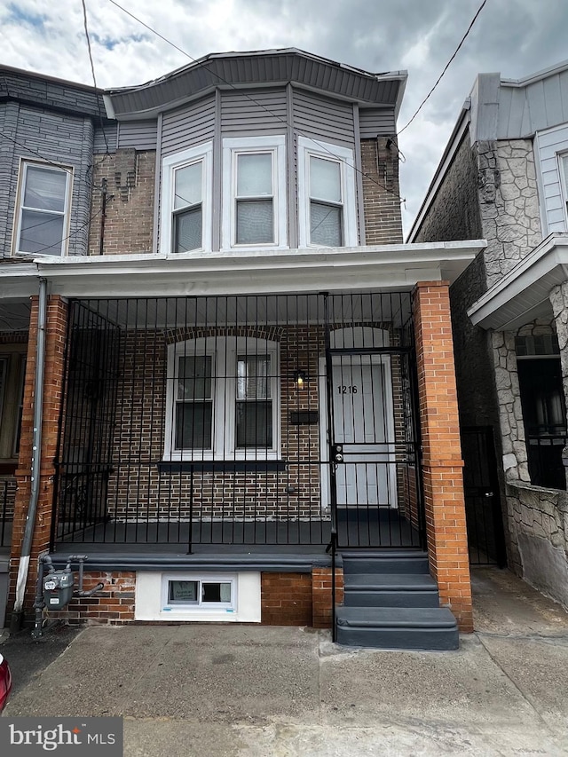 view of property with a porch