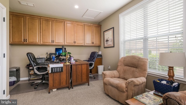 office area featuring light colored carpet