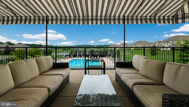 view of patio / terrace featuring a fenced in pool and an outdoor hangout area