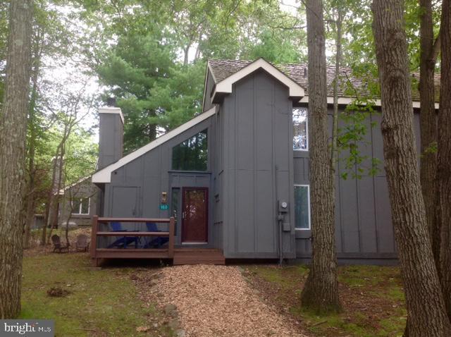 back of property featuring a deck