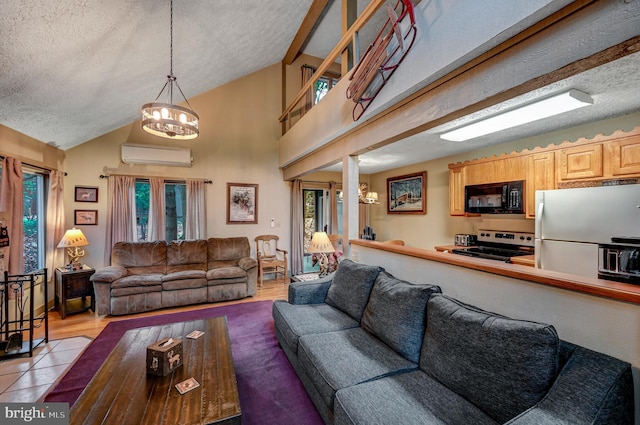 living room with a wall mounted air conditioner, a textured ceiling, lofted ceiling with beams, light hardwood / wood-style flooring, and a chandelier